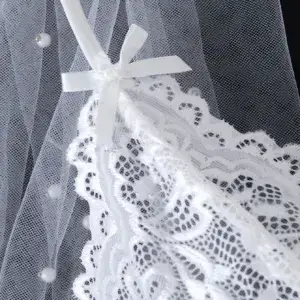 Elegant White Lace Bodysuit - Sexy Lingerie for Women with Crisscross Back Straps 5